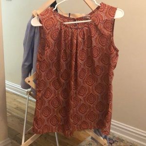 Sleeves less orange patterned top